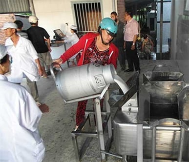 Local farmer in Vietnam at a Milk Collection Point
