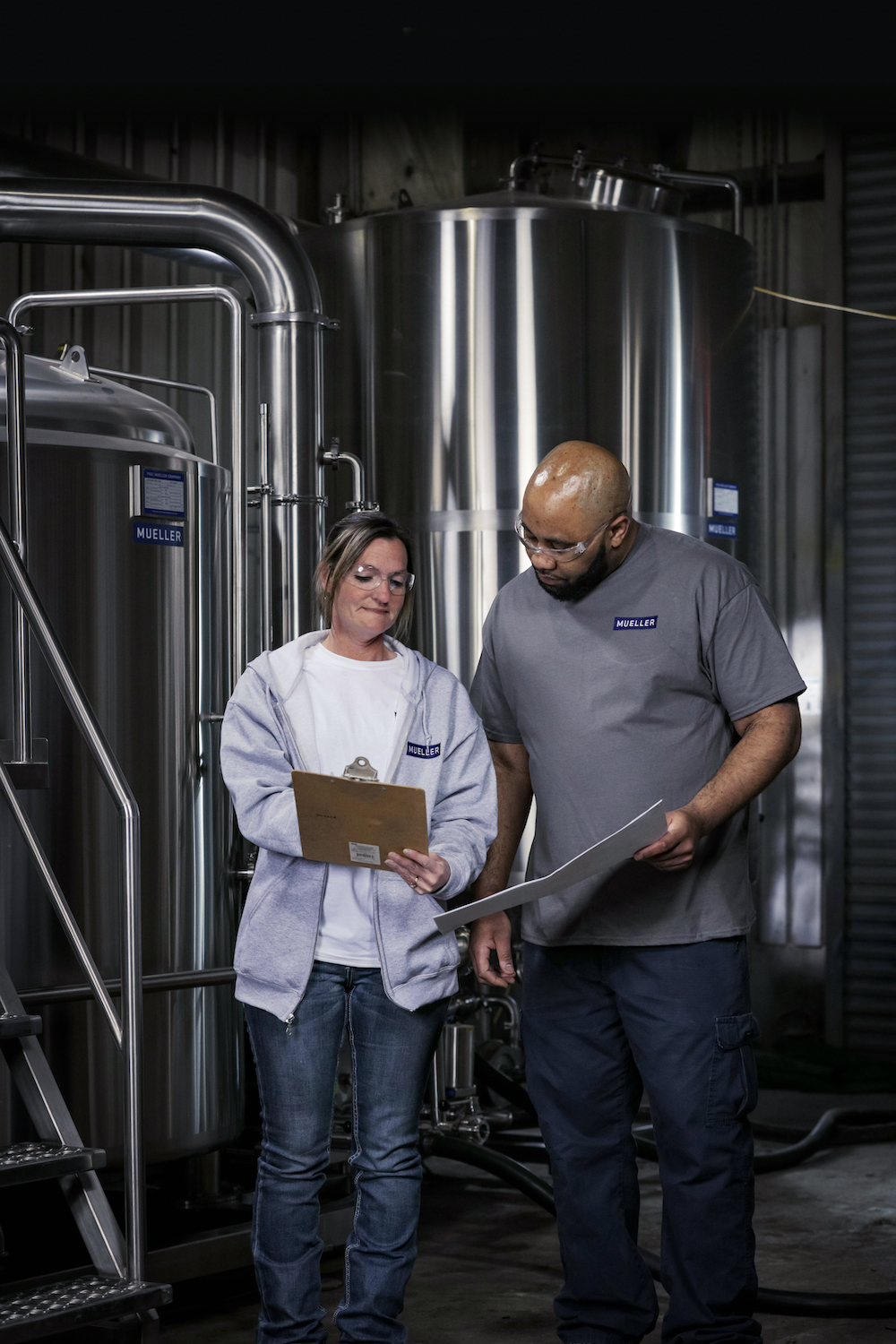 Paul Mueller Company Coworkers Reviewing Spec Sheet