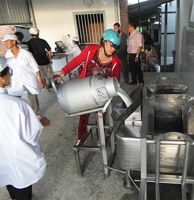 Local farmer in Vietnam at a Milk Collection Point